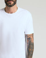 Pima Cotton Blend Crew 4-Pack on tattooed man's upper body.