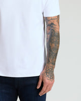Pima Cotton Blend Crew 4-Pack on person with tattooed arm.